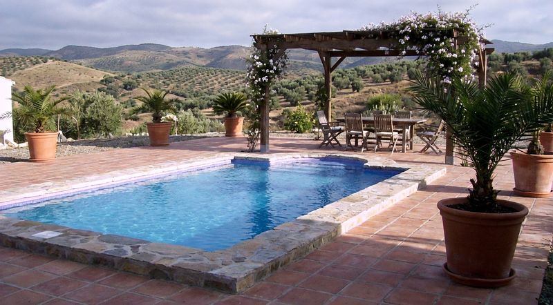 Swimming pool with pergola and mountain views in Andalusia